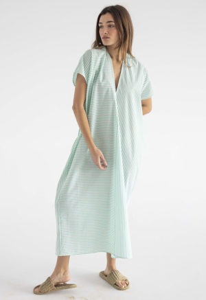 woman in green and white stripe kaftan