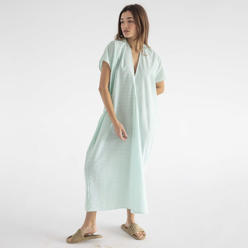 woman in green and white stripe kaftan