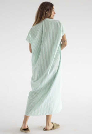 woman in green and white stripe kaftan