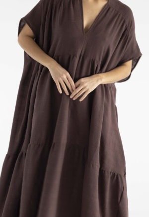 woman in dark brown v-neck maxi tiered dress