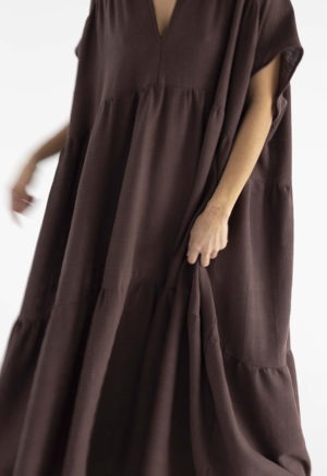 woman in dark brown v-neck maxi tiered dress