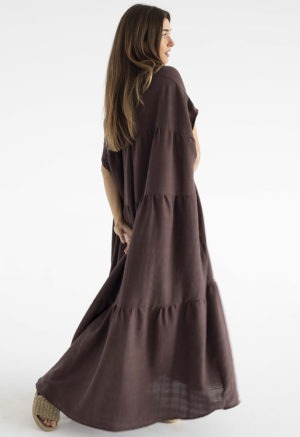 woman in dark brown v-neck maxi tiered dress