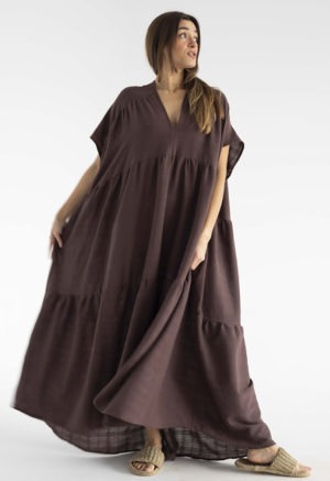woman in dark brown v-neck maxi tiered dress