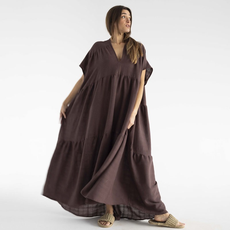 woman in dark brown v-neck maxi tiered dress