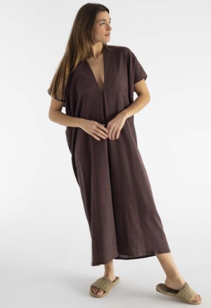 woman in dark brown kaftan with pleat in the front v-neck