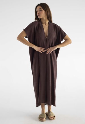 woman in dark brown kaftan with pleat in the front v-neck