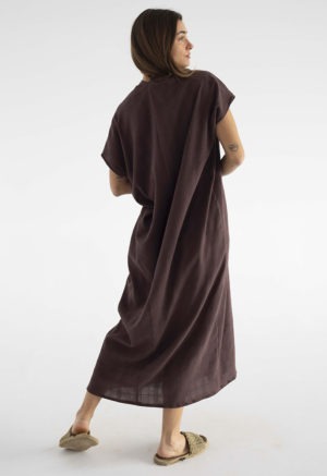 woman in dark brown kaftan with pleat in the front v-neck