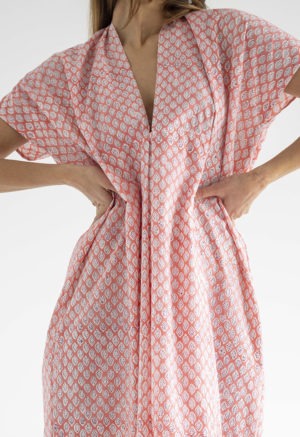 woman in pink floral kaftan