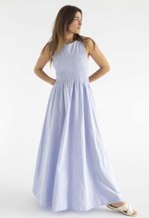 woman in light blue cotton ruched maxi length sundress