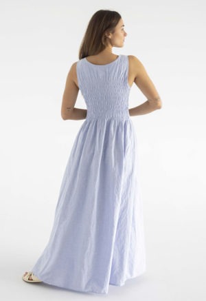 woman in light blue cotton ruched maxi length sundress