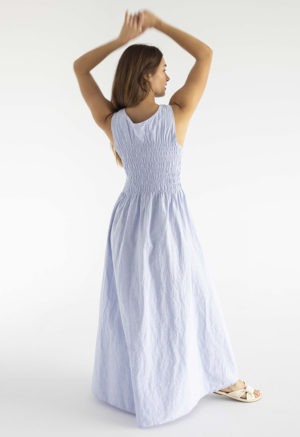 woman in light blue cotton ruched maxi length sundress