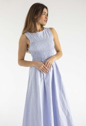 woman in light blue cotton ruched maxi length sundress