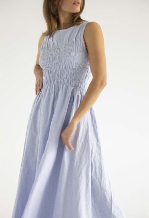 woman in light blue cotton ruched maxi length sundress