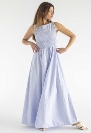 woman in light blue cotton ruched maxi length sundress