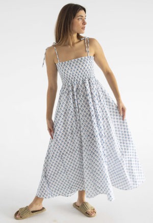 women in white and teal floral sundress