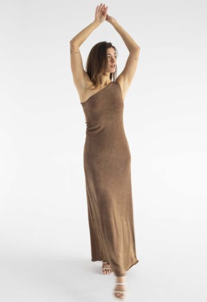woman in brown slinky one shoulder maxi dress