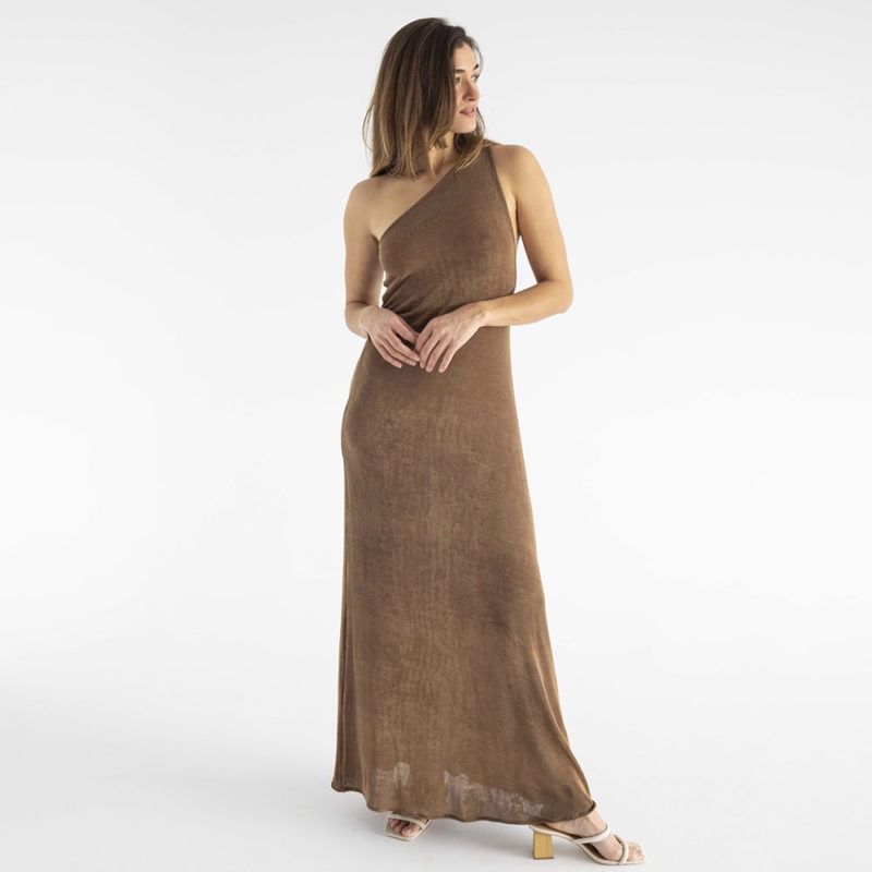 woman in brown slinky one shoulder maxi dress