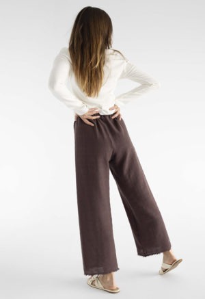 woman in brown cotton gauze pants and white rib shirt