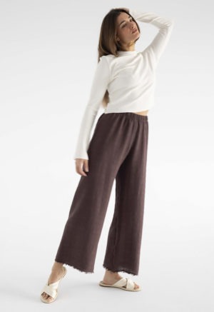 woman in brown cotton gauze pants and white rib shirt