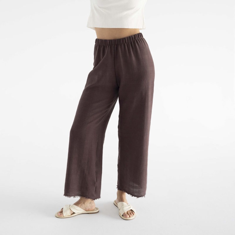 woman in brown cotton gauze pants and white rib shirt