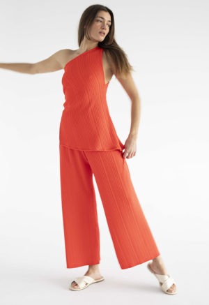 woman in red pleated pant and matching tank