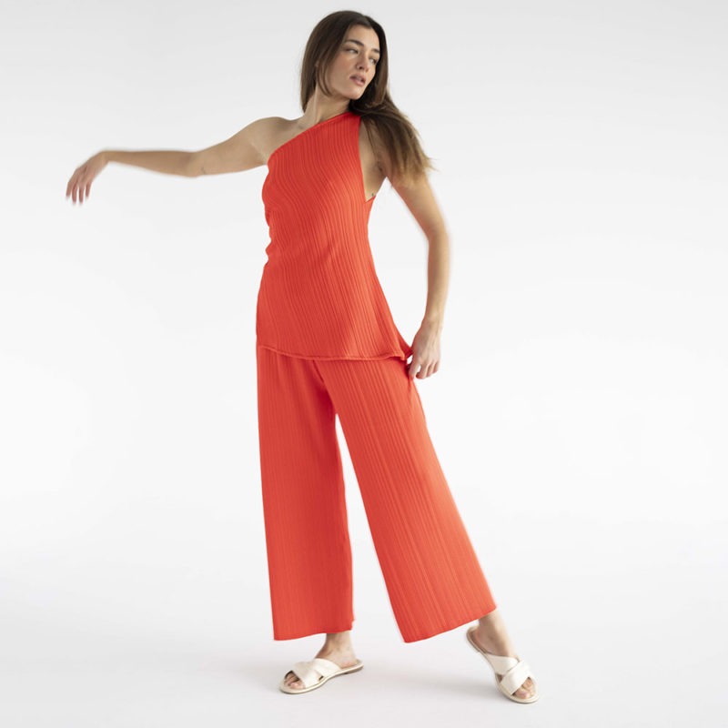 woman in red pleated pant and matching tank