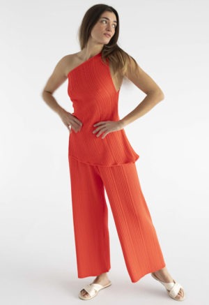 woman in red pleated pant and matching tank