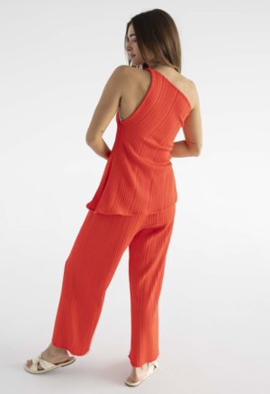 woman in red pleated pant and matching tank