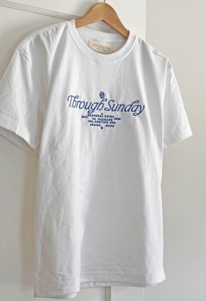 white t-shirt with blue embroidery on front chest