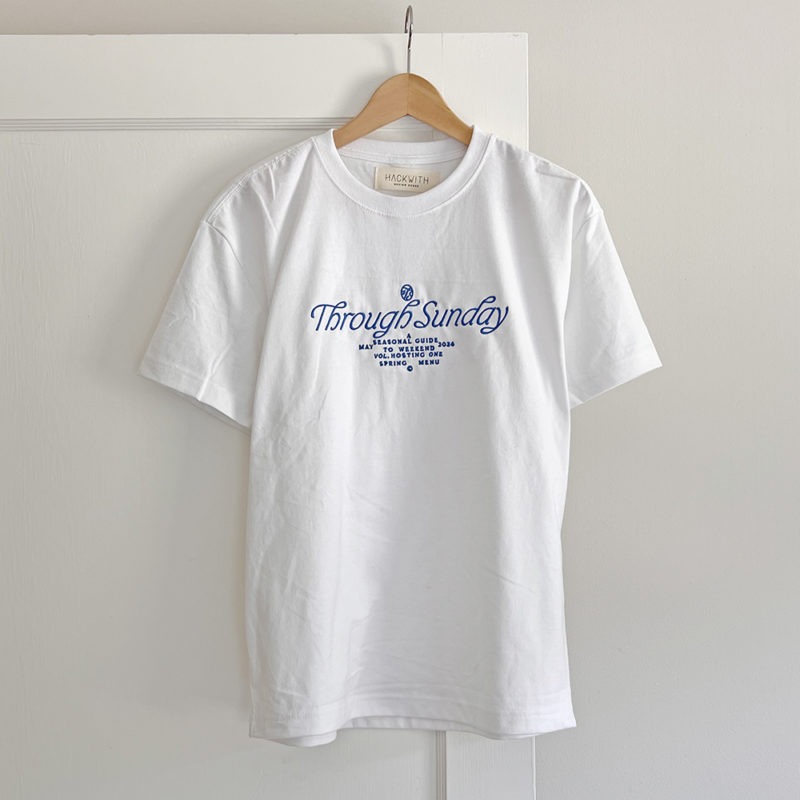 white t-shirt with blue embroidery on front chest