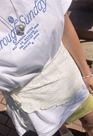 white t-shirt with blue embroidery on front chest