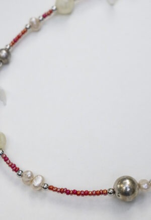 small red beaded necklace with pearls and shells