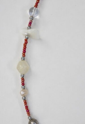 small red beaded necklace with pearls and shells