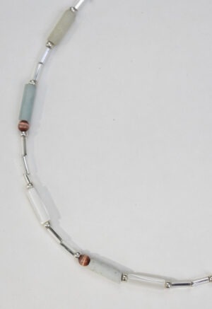 necklace of light green, red and silver beads