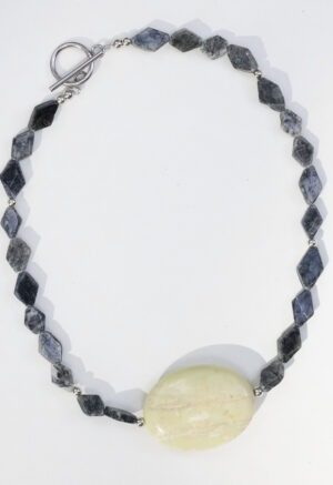 dark green stone necklace with large middle center rock