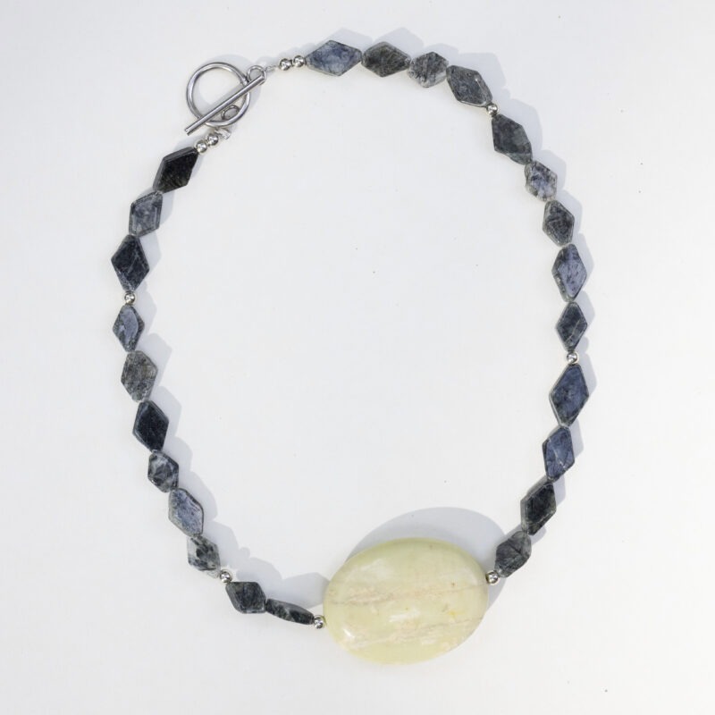 dark green stone necklace with large middle center rock