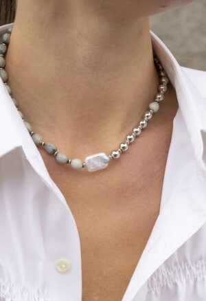 woman wearing green shell, pearl and silver bead necklace