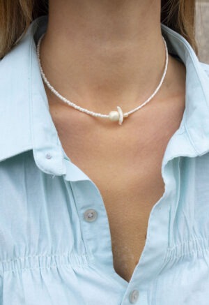 woman wearing pearl necklace