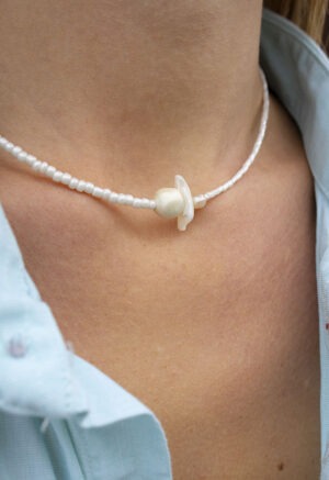 woman wearing pearl necklace