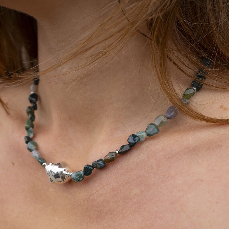 green rock bead necklace on woman