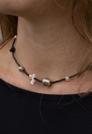 black necklace on woman