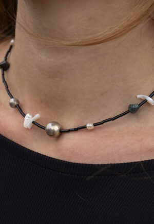 black necklace on woman