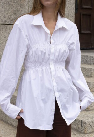 woman in white button-up