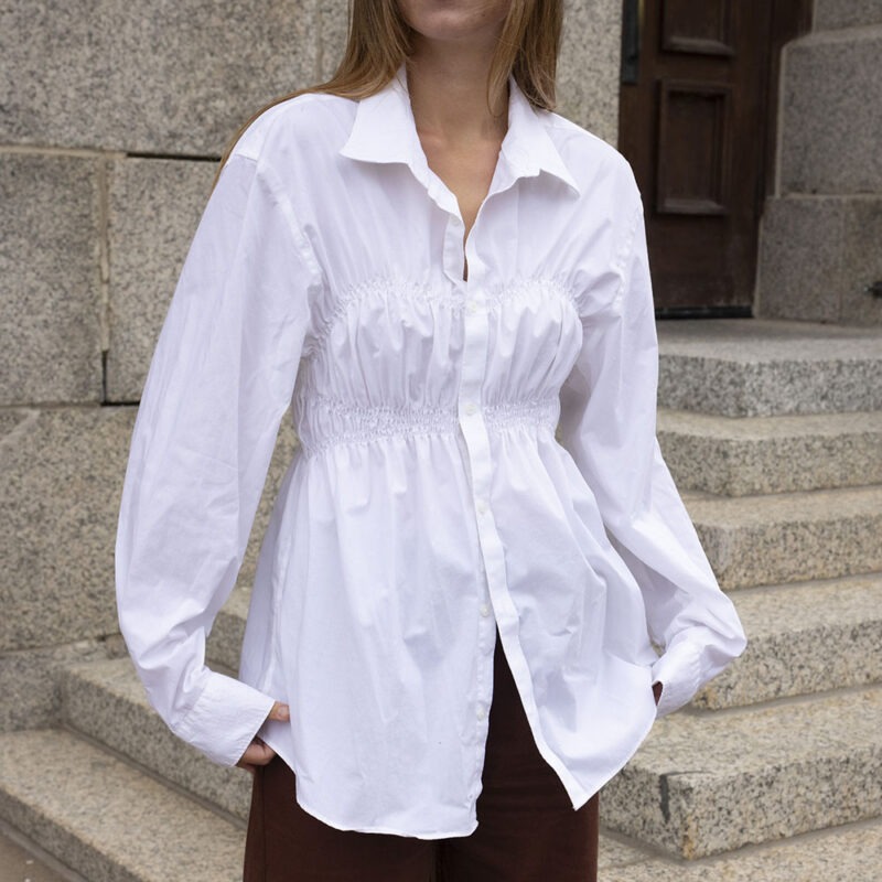 woman in white button-up