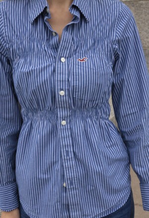 woman in blue and white stripe button-up shirt