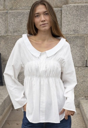 woman in white shirt and blue jeans