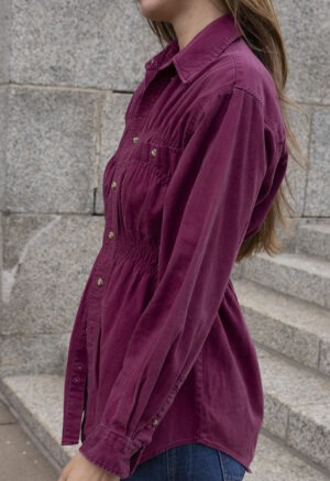 woman in maroon shirt and jeans