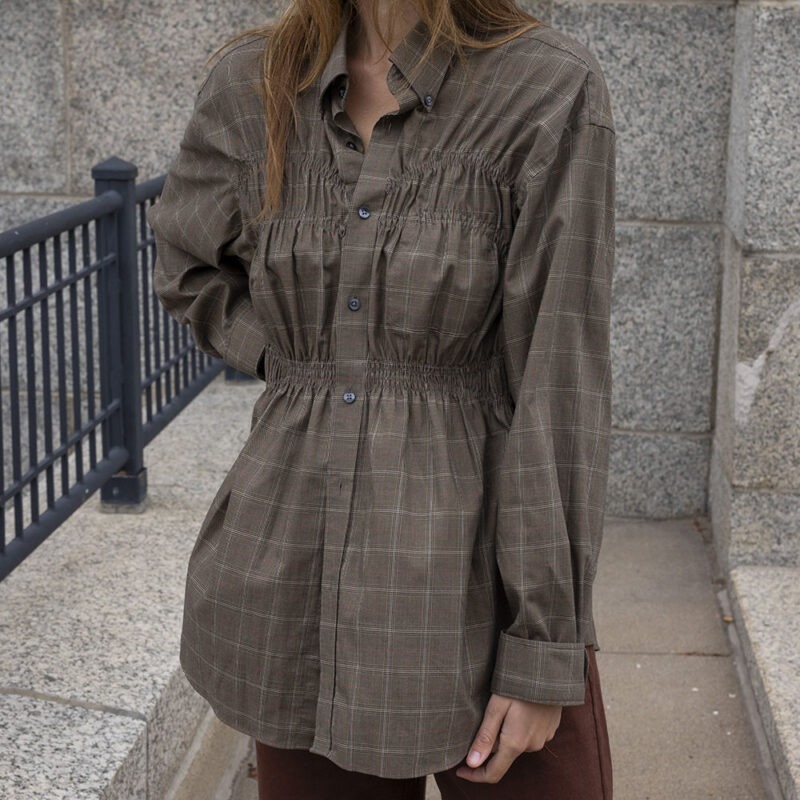 woman in plaid button-up