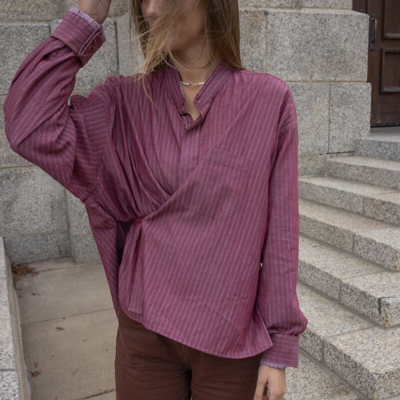 woman in red button-up wrap top
