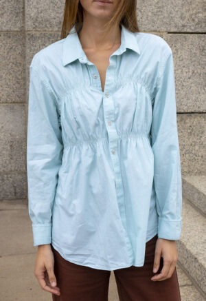 woman in teal button-up
